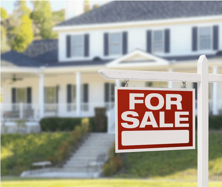 Red for sale sign in front of house